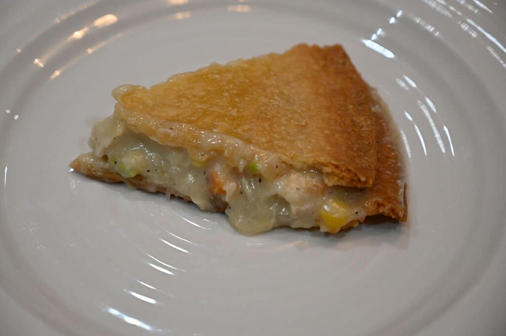 A slice of the chicken pot pie on a plate.