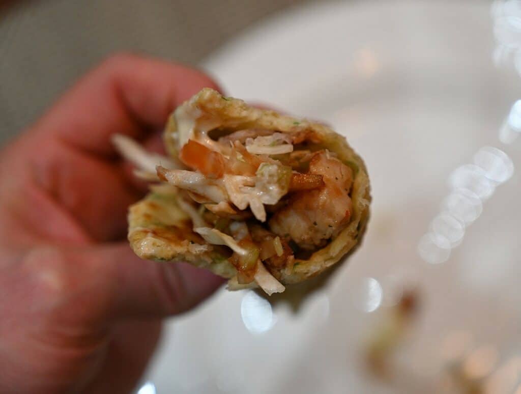 Costco Chicken Yakitori Flatbread closeup of flatbread prepared and with a bite out of it