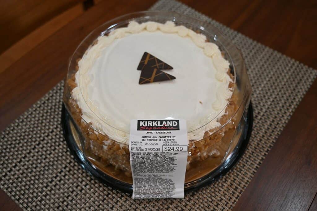 Costco Kirkland Signature Carrot Cheesecake image of whole carrot cake with lid on and in package 