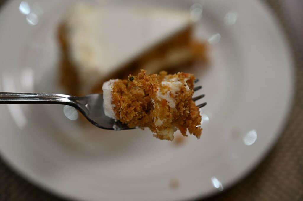 Costco Kirkland Signature Carrot Cheesecake image of a bite of carrot cheesecake on a fork