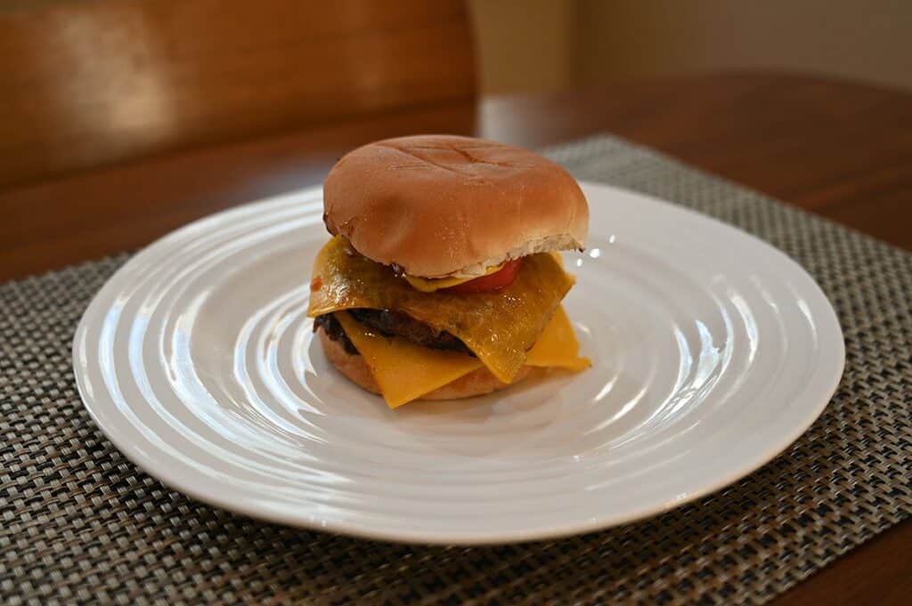 Costco Kirkland Signature Lean Ground Beef Patties fully cooked burger on a bun with cheese