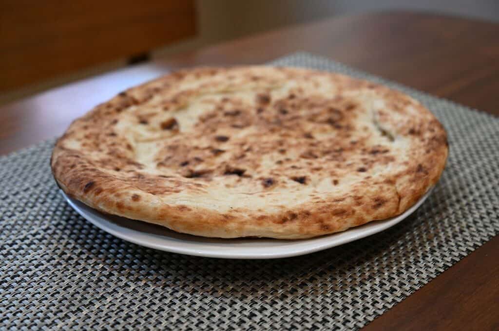 Costco Molinaro's Napolitano Pizza Kit image of one pizza crust on a plate prior to baking 