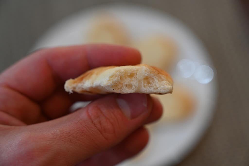 Costco Panaji Original Naan Minis close up photo of one naan mini with a bite taken out 