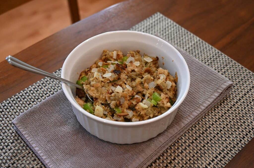 Costco Back to Nature Gourmet Stuffing Mix prepared in baking dish with spoon sitting in it