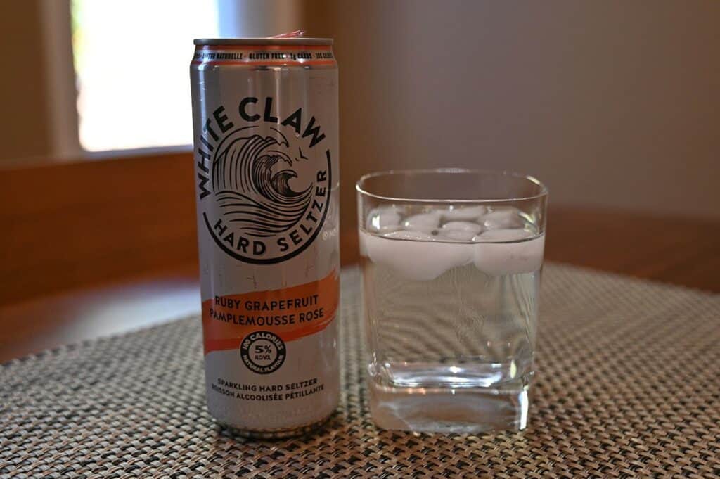 Costco White Claw Hard Seltzer poured into a glass with the can beside it