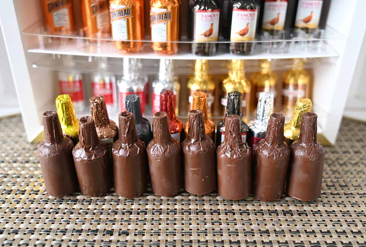 Image of the eight different kinds of chocolates unwrapped standing up in a line.