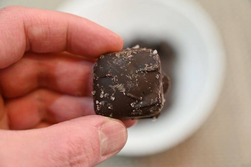 Closeup image of one Costco Sanders Dark Chocolate Sea Salt Caramel 