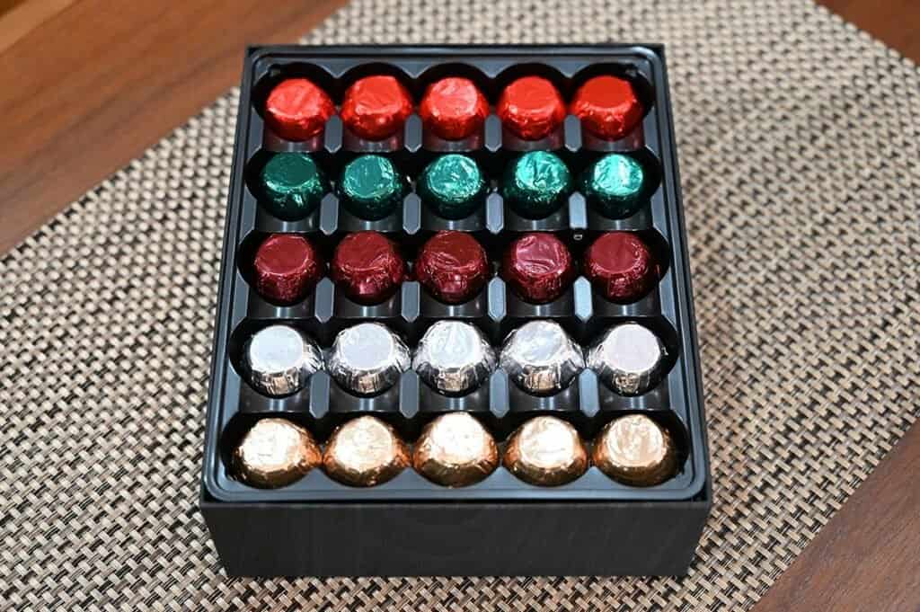 Image of the Costco Kirkland Signature Liquor Collection Belgian Chocolates with the lid off the box showing the rows of the five different chocolates in the box. 