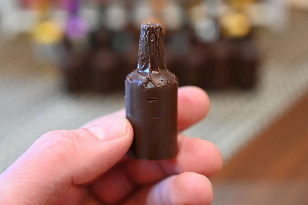 A close-up of an unwrapped chocolate.