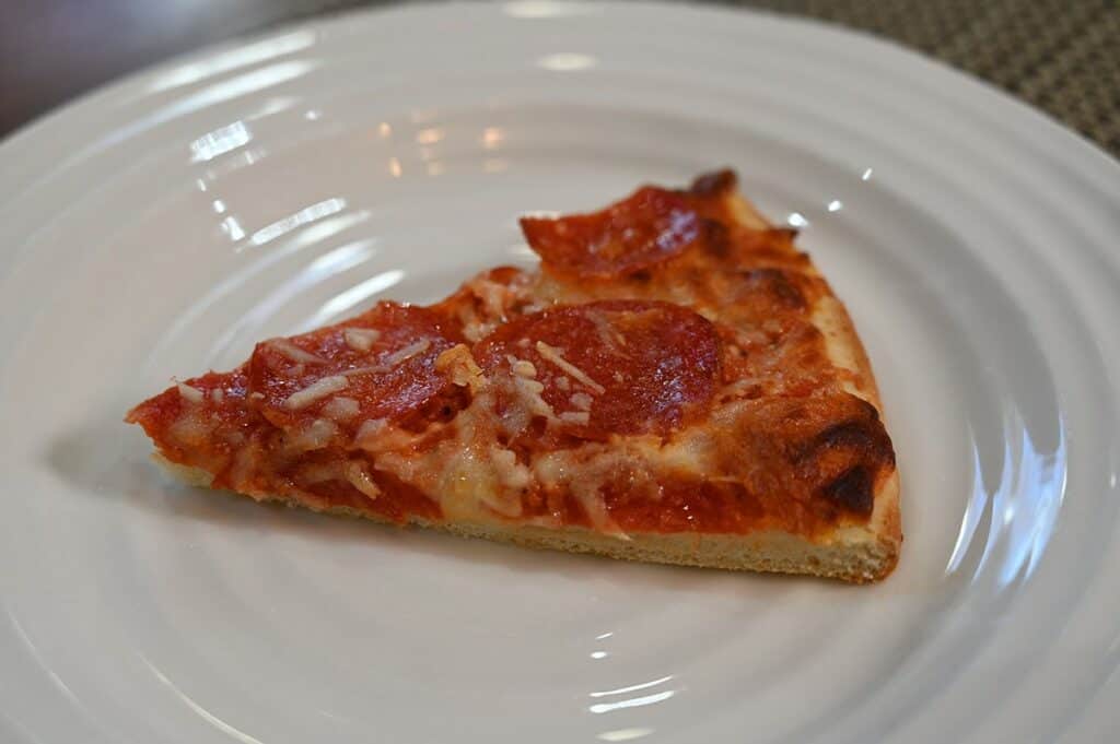 Costco Kirkland Signature Pepperoni Pizza image of a slice of pizza on a plate 