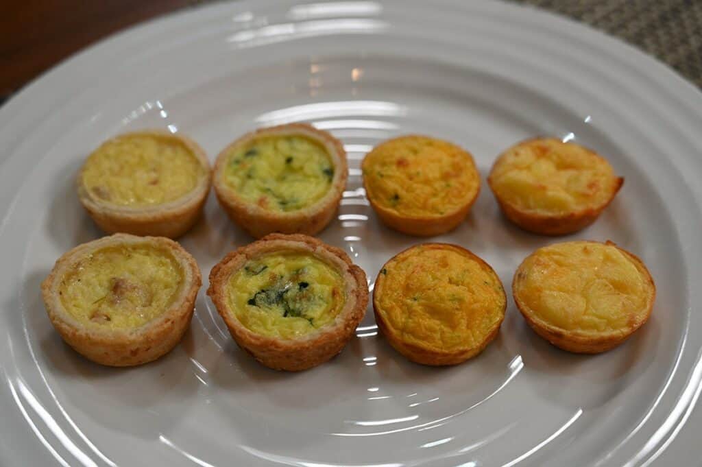 Costco Cuisine Adventures Mini Quiche  image of eight quiche on a plate, two of each kind. 