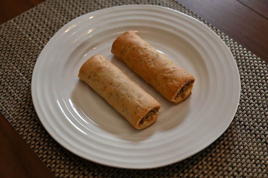 Image of two Costco Prairie Creek Kitchen Sausage Beef Rolls cooked and on a plate 