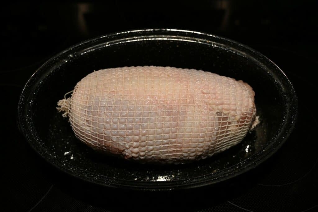 Image of raw Costco Lilydale Turkey Breast Roast in roasting pan prior to cooking it