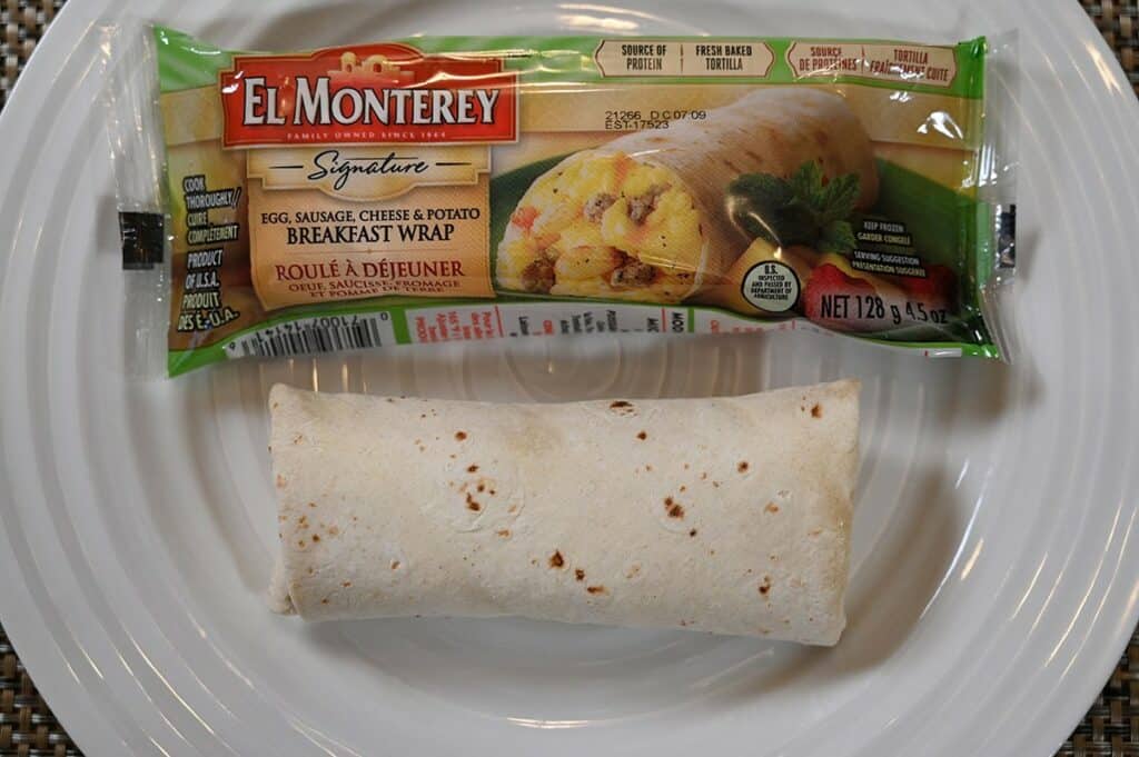 A top-down photo of the Costco El Monterey Breakfast Wrap on a plate with the packaging beside it