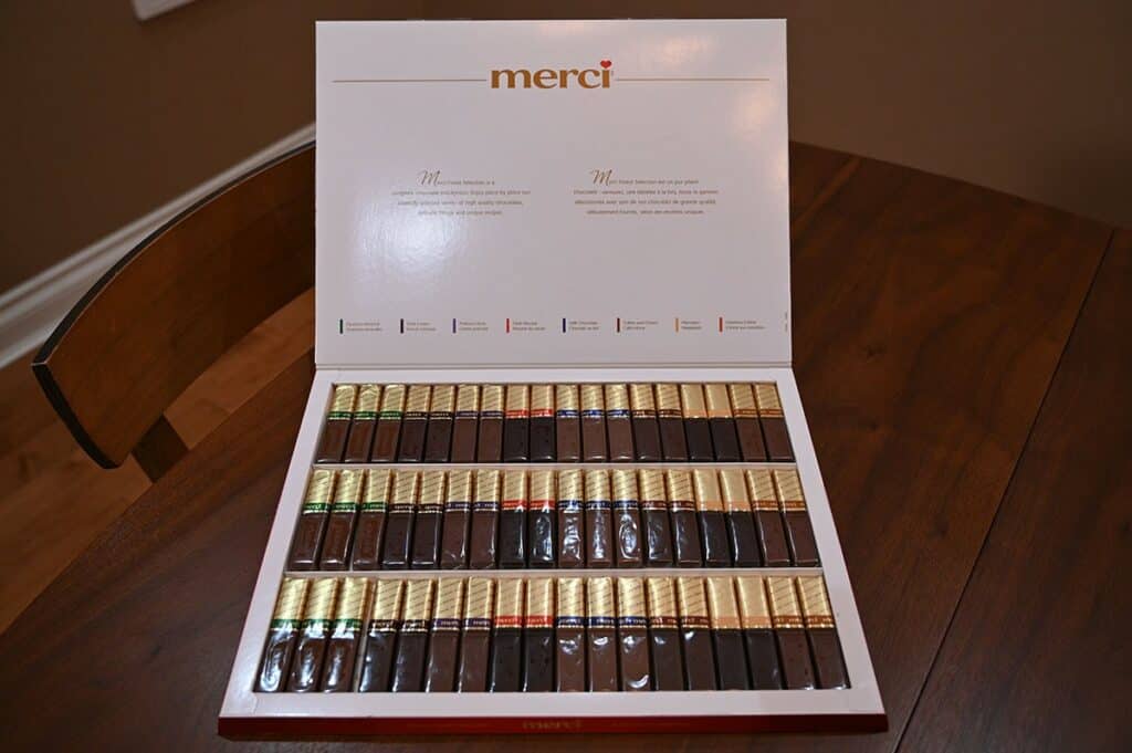 Image of the eight different varieties of Costco Merci European Chocolates shown in the box, 54 chocolates in total. 
