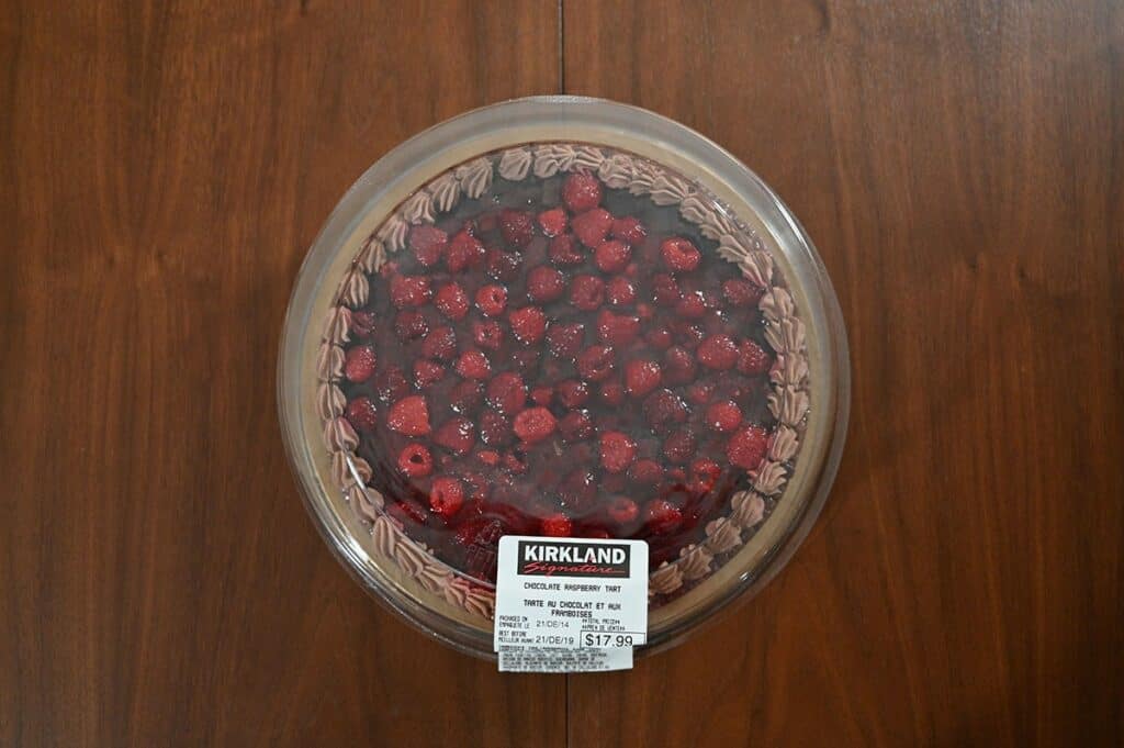 Top down image of the Costco Kirkland Signature Chocolate Raspberry Tart with the container lid on.