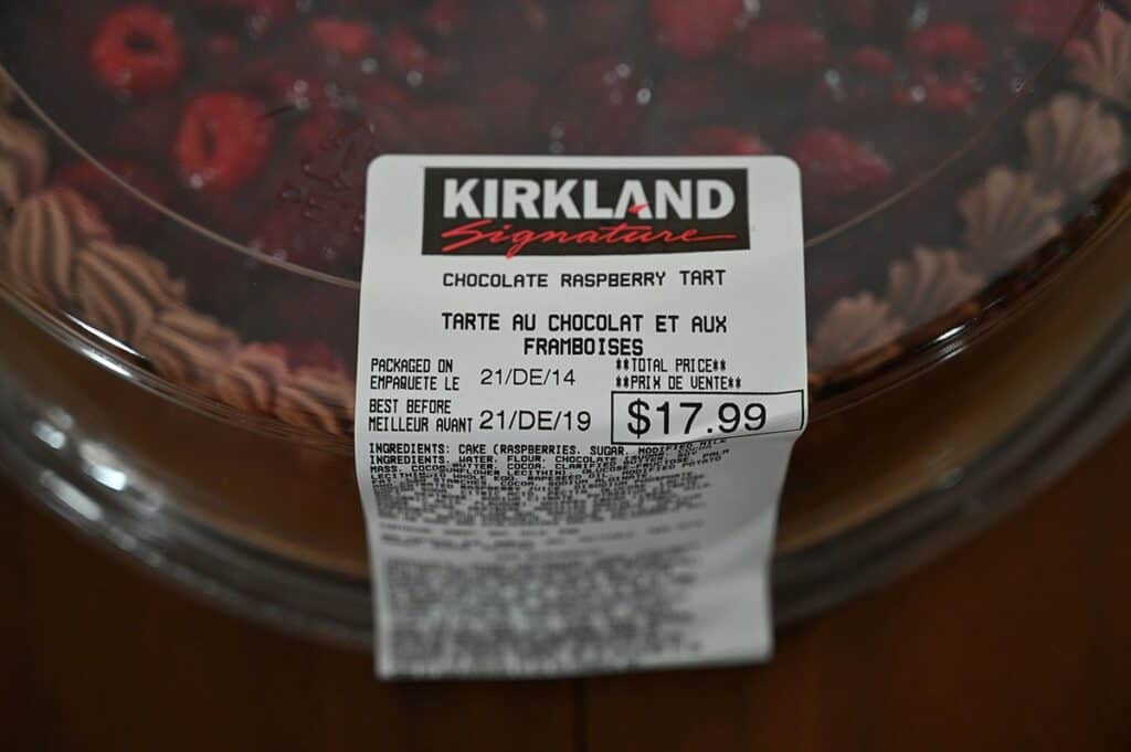 Close up image of the Costco Kirkland Signature Chocolate Raspberry Tart label with the best before date and cost. 