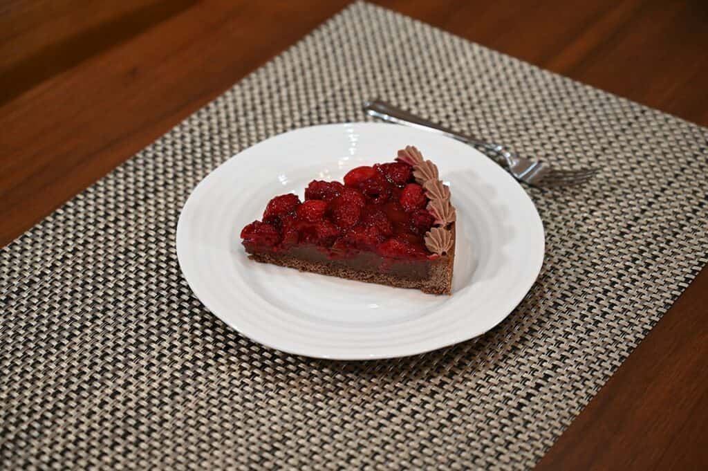 Image of one slice of the Costco Kirkland Signature Chocolate Raspberry Tart with the so you can see the distinct layers. 