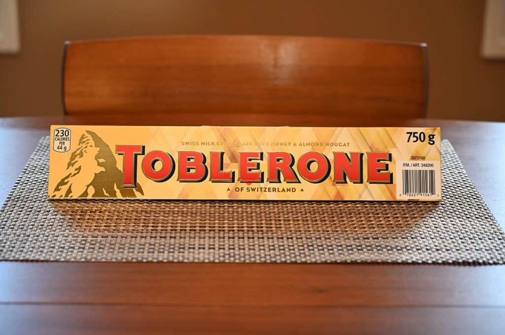 Image of the Costco Toblerone bar in the wrapper sitting on the table 