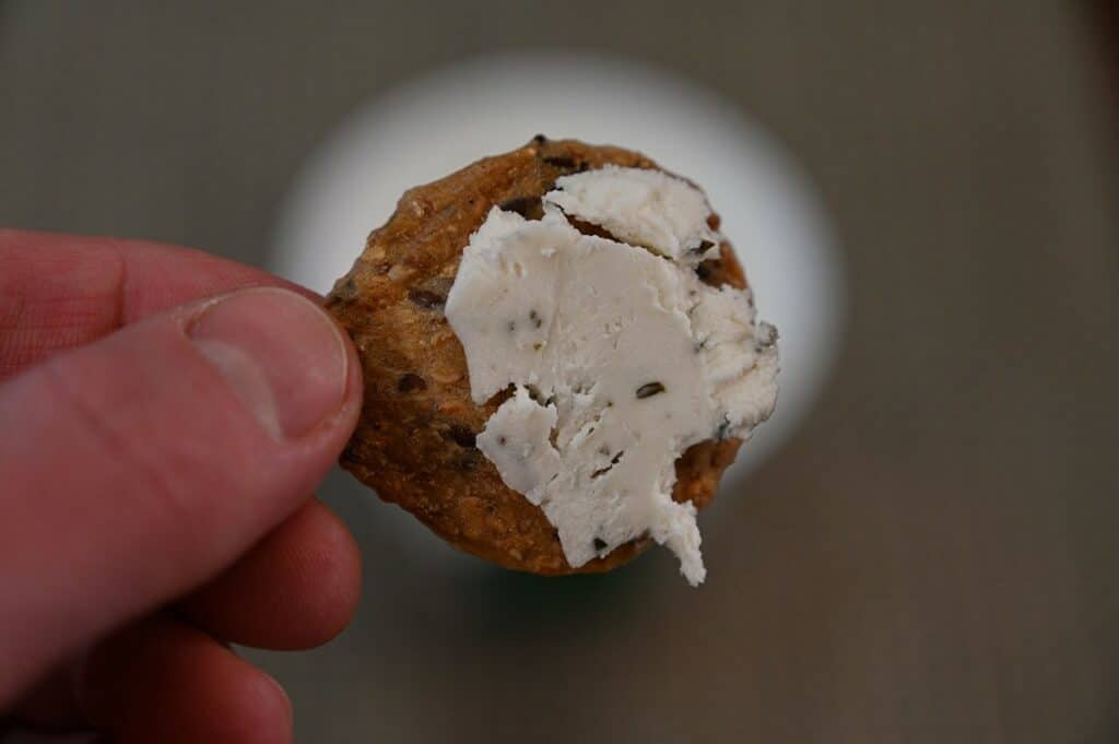 Costco dairy-free Boursin spread on a cracker, close up image.