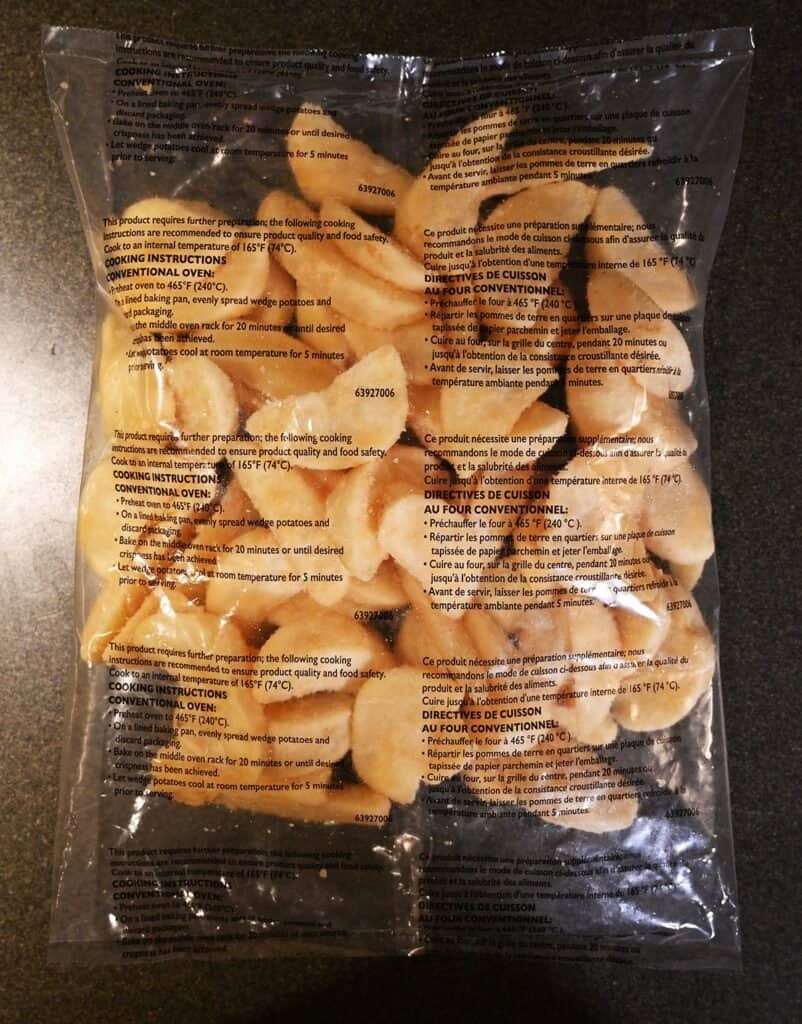 Costco Kirkland Signature Fish & Chips Meal Kit  bag of potato wedges sitting on a counter