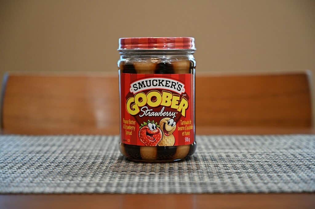 Costco Smucker's Goober jar on a table sitting on a placemat