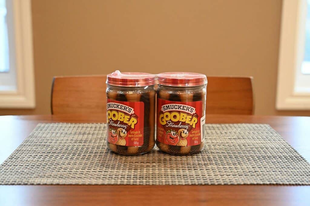 Costco Smucker's Goober two-pack of two jars sitting on a table on a placemat