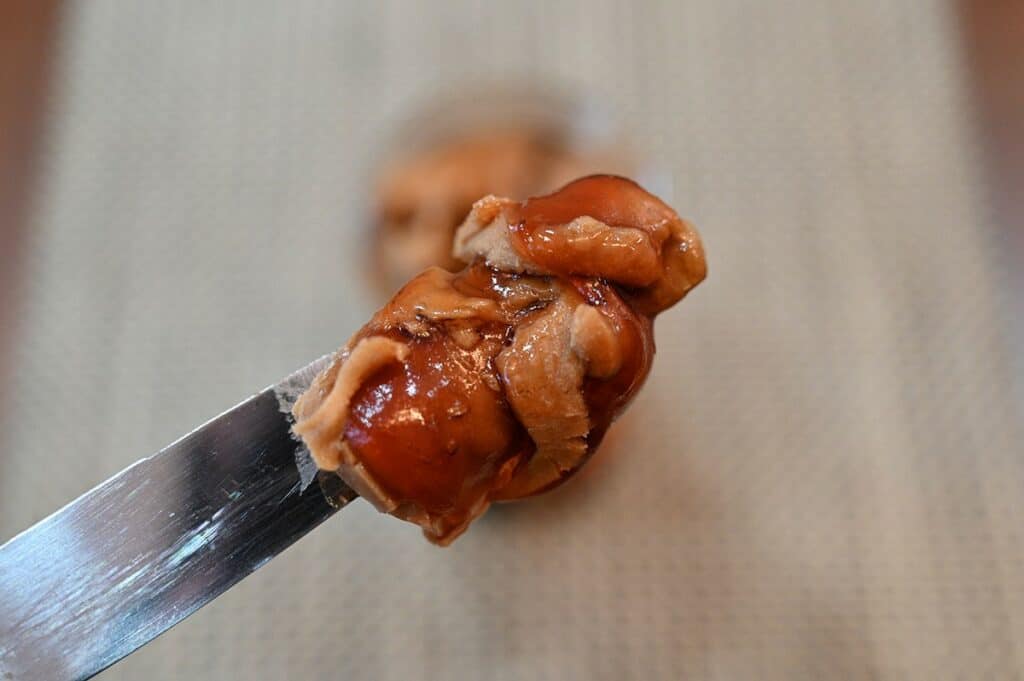 Closeup image of Costco Smucker's Goober on a knife. 