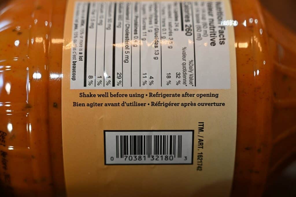 Costco Johnny's Sweet, Hot & Crazy Marinade and Wing Sauce bottle image stating to refrigerate after opening and shake well. 