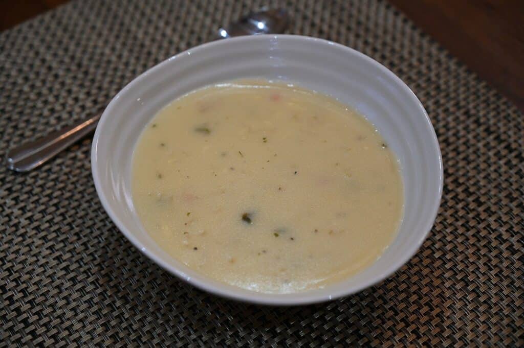 Costco Johnny's Potato Cheddar Soup Mix prepared and served in a white bowl.