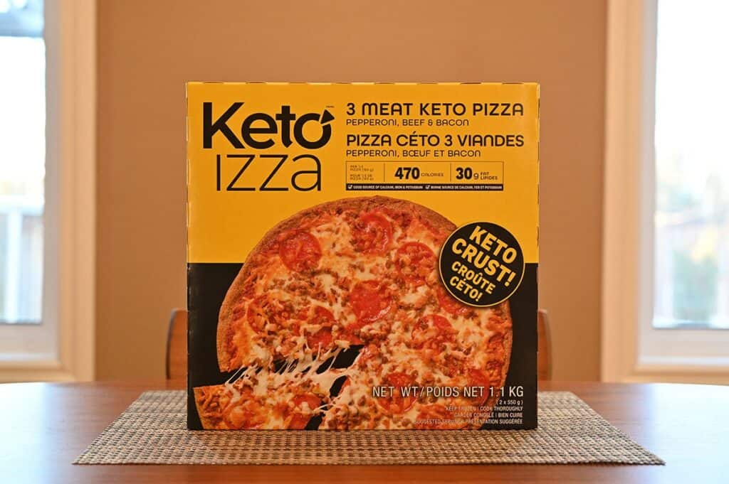 Costco Keto Izza Keto Pizza box sitting on a brown table. 