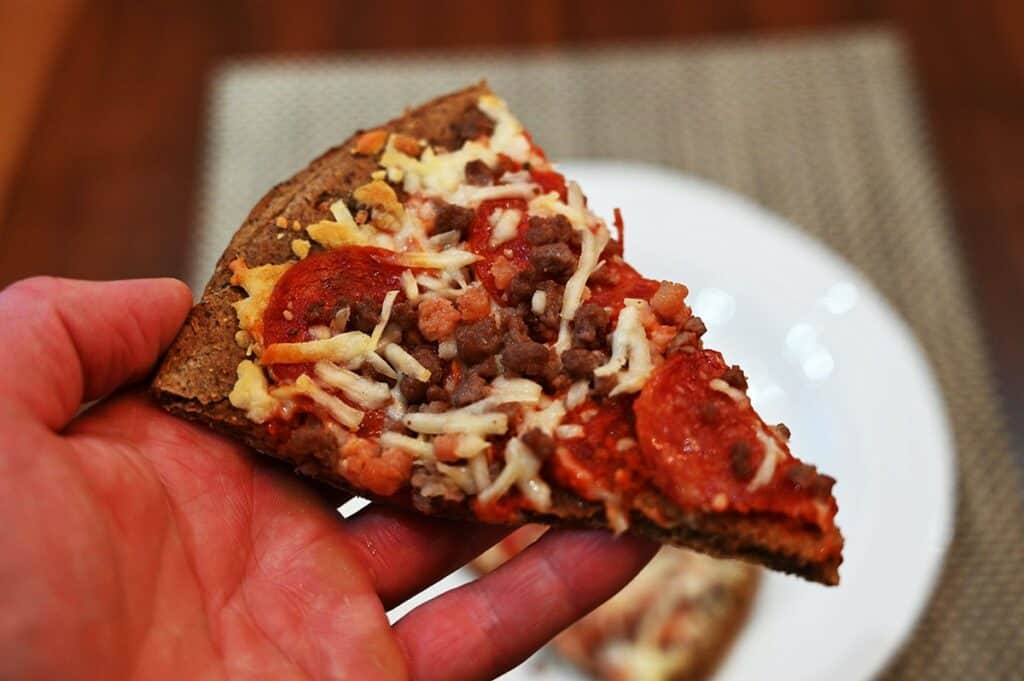 A slice of the Costco Keto Izza Keto Pizza. Closeup image. 
