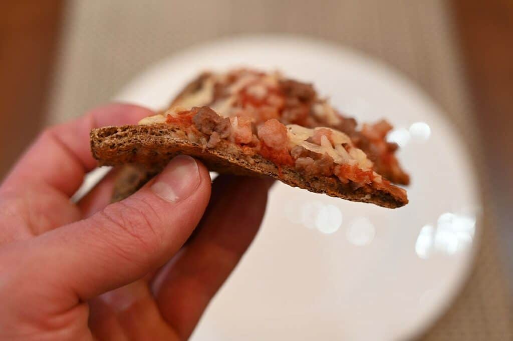 Side view of a slice of Costco Keto Izza Keto Pizza, closeup image. 