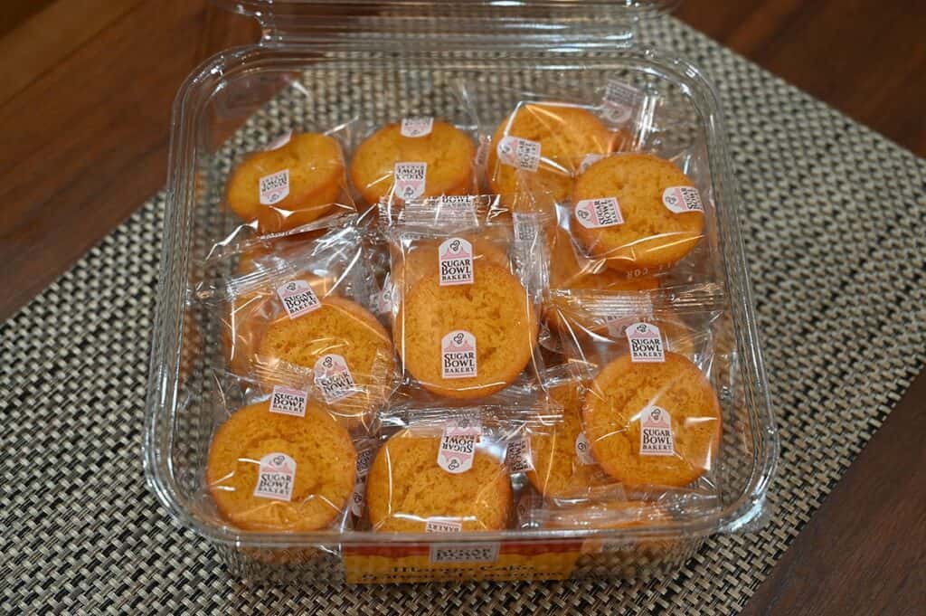 Costco Sugar Bowl Bakery Mango Cake container opened and on a table showing the individually wrapped cakes. 