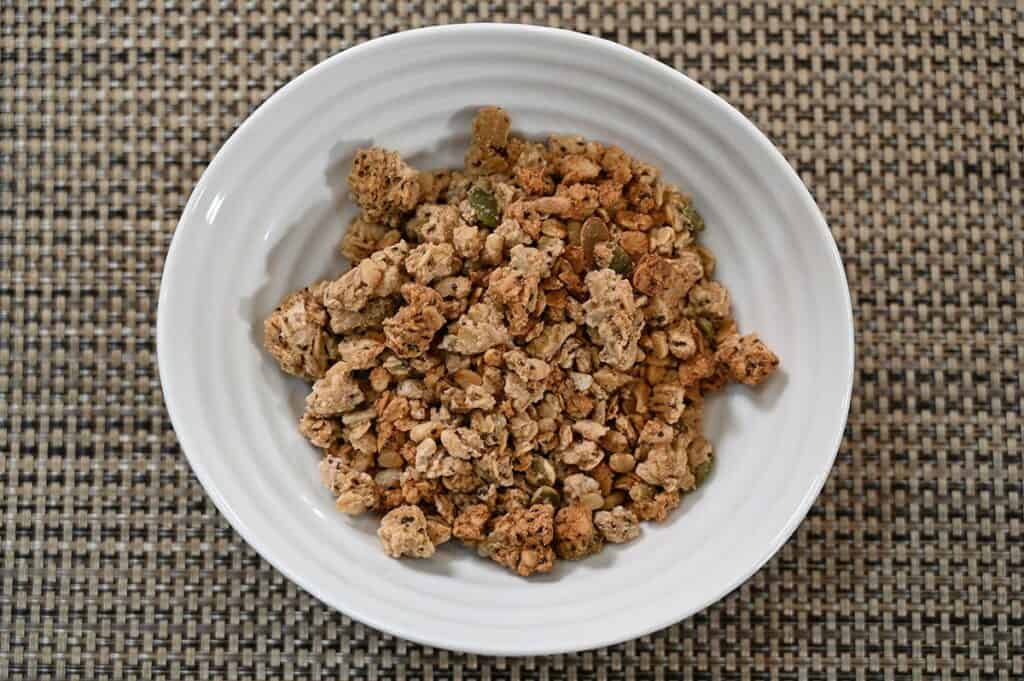 Costco Prana Granolove Oatmeal Cookie Crunch Granola poured into a white bowl top down image. 