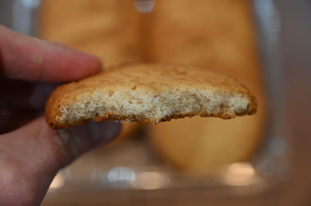 Costco Verka Honey Almond Cookie closeup image with a bite taken out of it showing the center. 