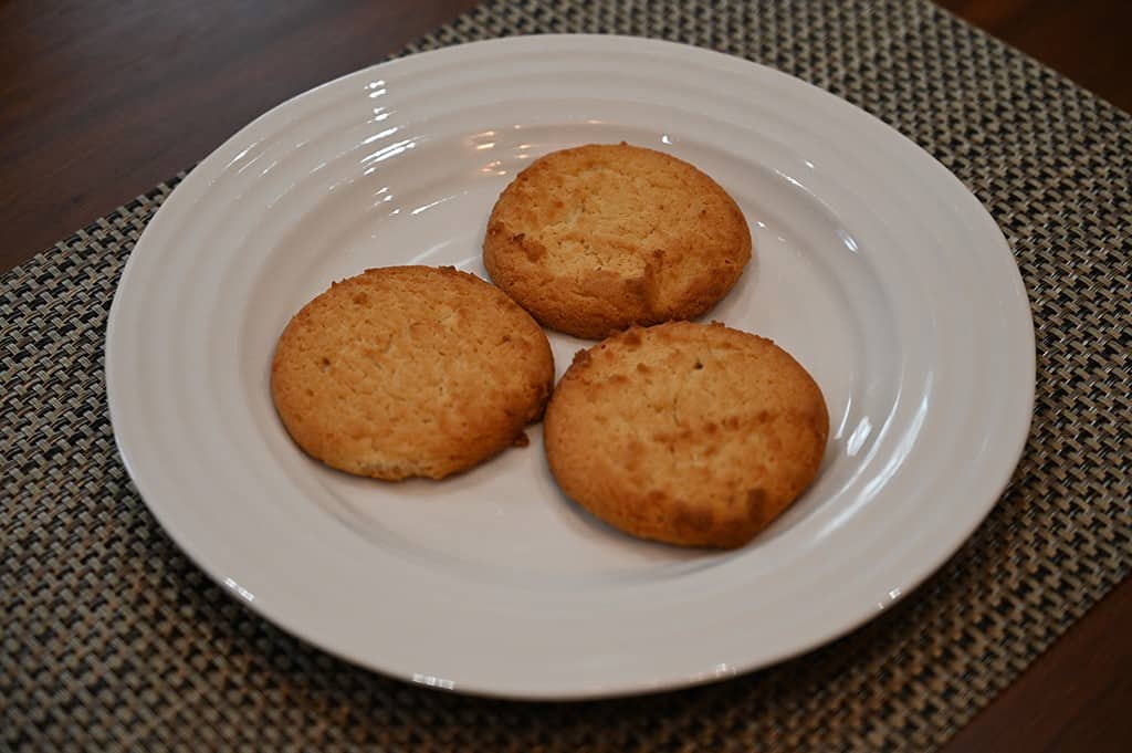 Three Costco Verka Honey Almond Cookies on a white plate. 