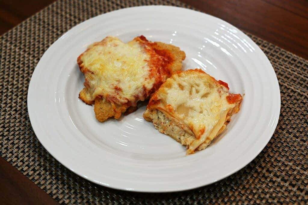 Costco Kirkland Signature Chicken Parmigiana on Cheese Lasagna cooked and on a white plate