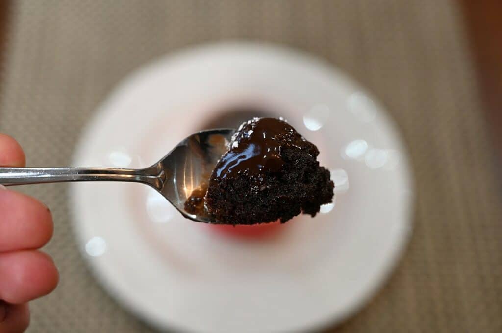 Closeup image of a spoonful of Costco Delici Belgian Chocolate Soufflé showing the melted molten chocolate center after heating.