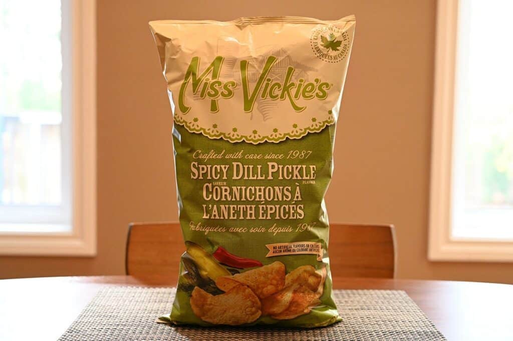 Costco Miss Vickie's Spicy Dill Pickle Chips bag sitting on a table. 