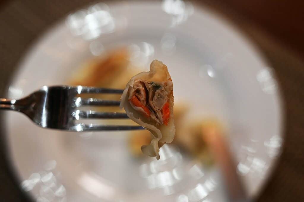 Costco Summ! Sesame Ginger Chicken Gyoza Dumpling cut in half so you can see the filling. 