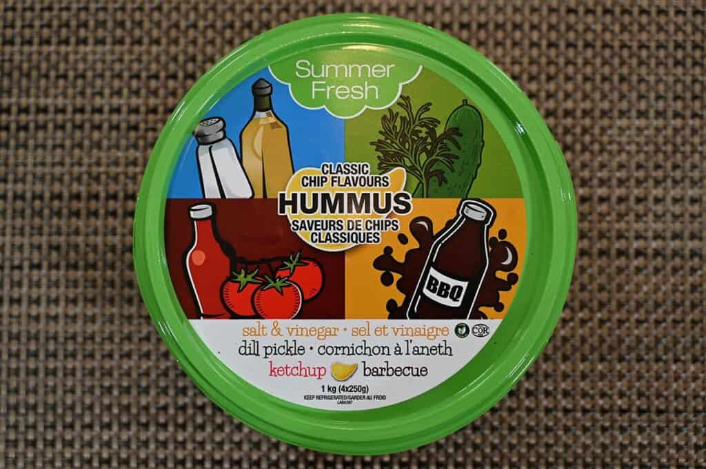 Costco Summer Fresh Classic Chip Flavours Hummus container on a placemat with a top down image. 