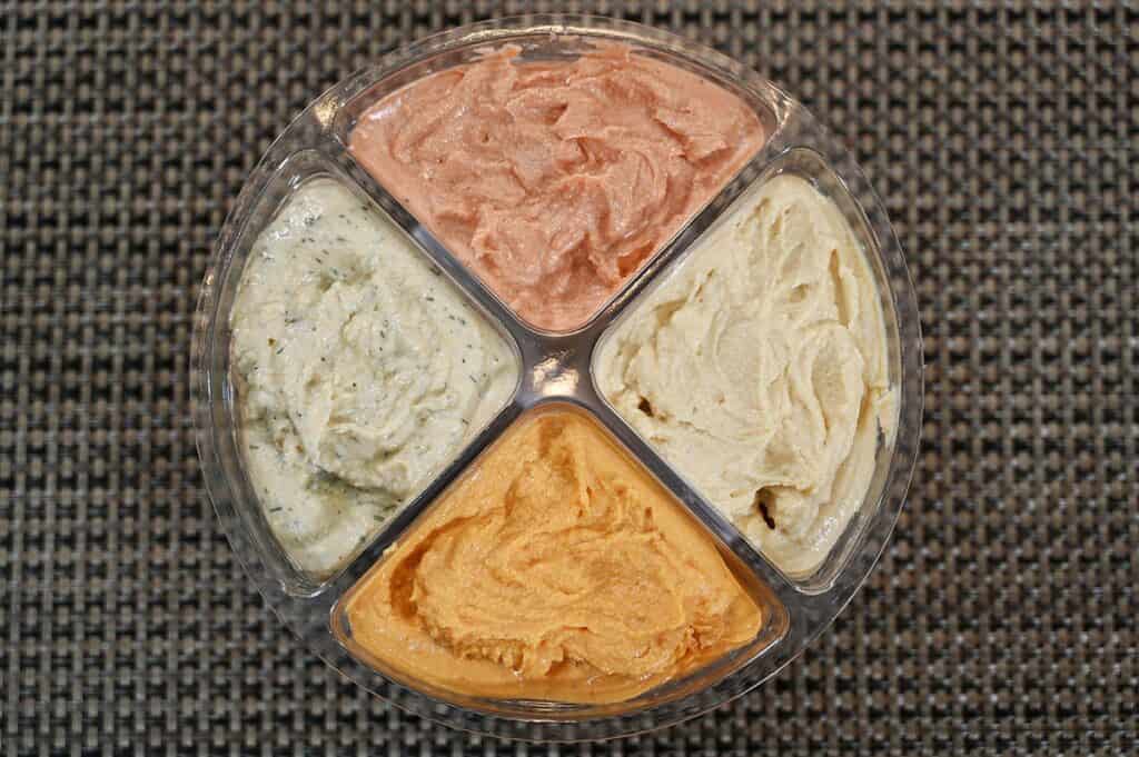 Costco Summer Fresh Classic Chip Flavours Hummus top down image with lid off. Ketchup at the top, barbecue at the bottom, dill pickle on the left, salt & vinegar on the right. 