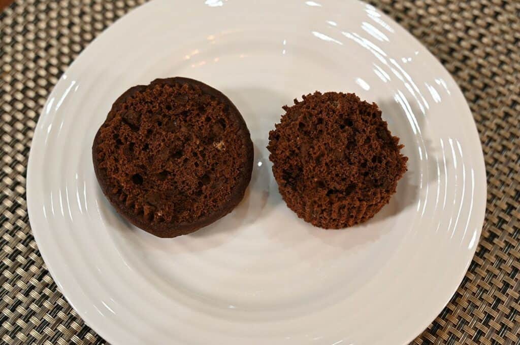 Costco Bread Garden Double Chocolate Keto Muffins cut open and on a plate in half see the middle. 