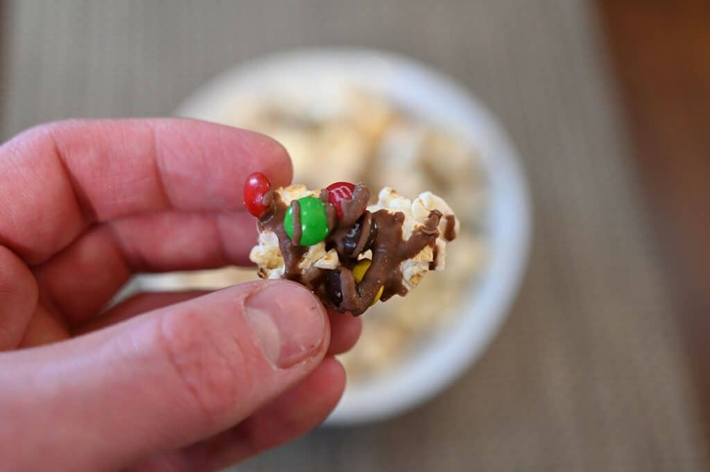 Close up image of one piece of Costco Candy Pop Popcorn M&M's Minis