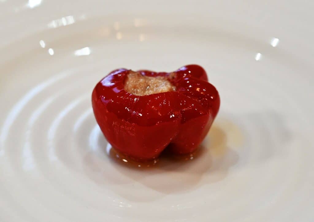 One Costco Tasso's Papandoro Peppers Stuffed With Feta & Kalamata Olives on a white plate, closeup image.