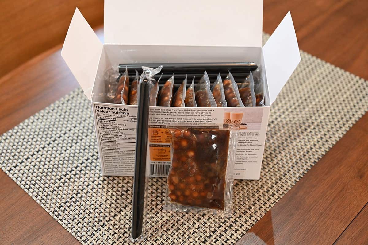 Costco Boba Bam Instant Boba Pack box opened so you can see the packs  of boba and straws. 
