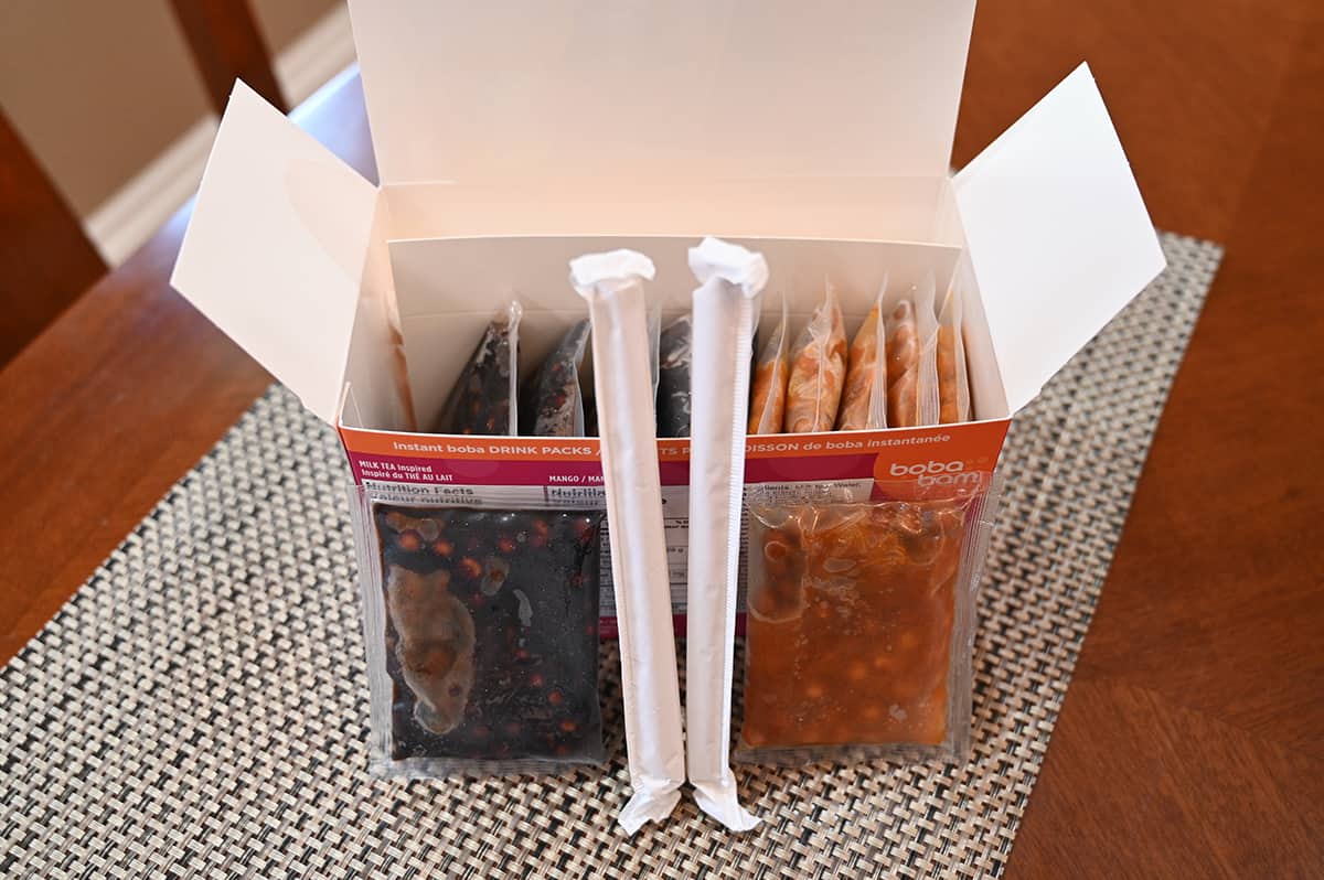 Image of the milk tea and mango tea boba bam instant boba pack box open showing the straws and packets of boba that come in the pack.