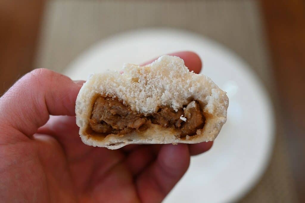 A closeup image of the pork in the middle of the Costco Made Fresh Foods BBQ Pork Buns .