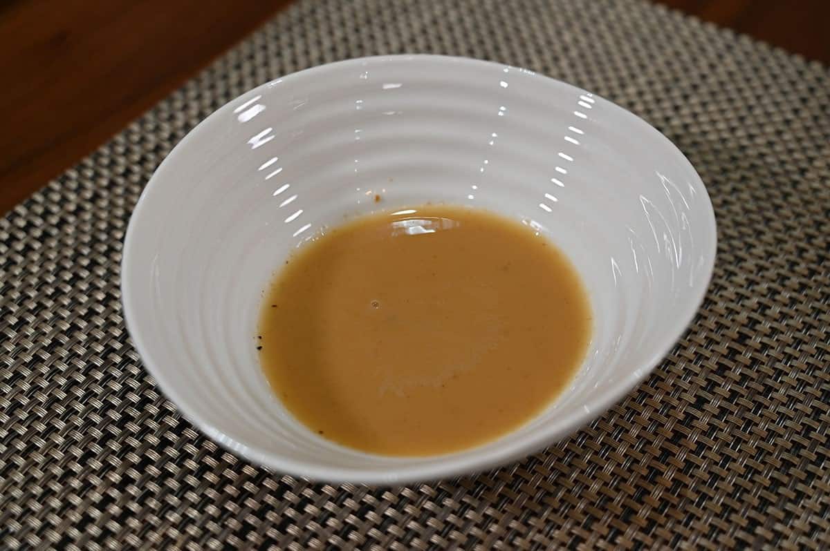 Costco Summ! Pork & Shiitake Gyoza Dumplings dipping sauce poured into a white bowl. 